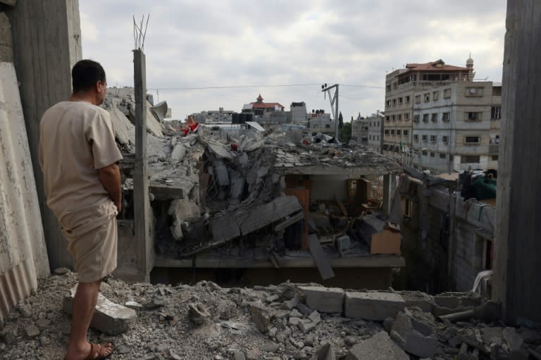 Israel's offensive has devastated buildings in towns such as Rafah (-)