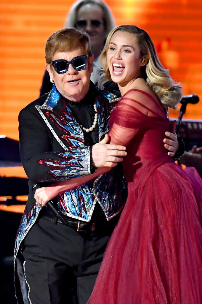 Elton John and Miley Cyrus perform at the Grammys. (Photo: Jeff Kravitz/FilmMagic)