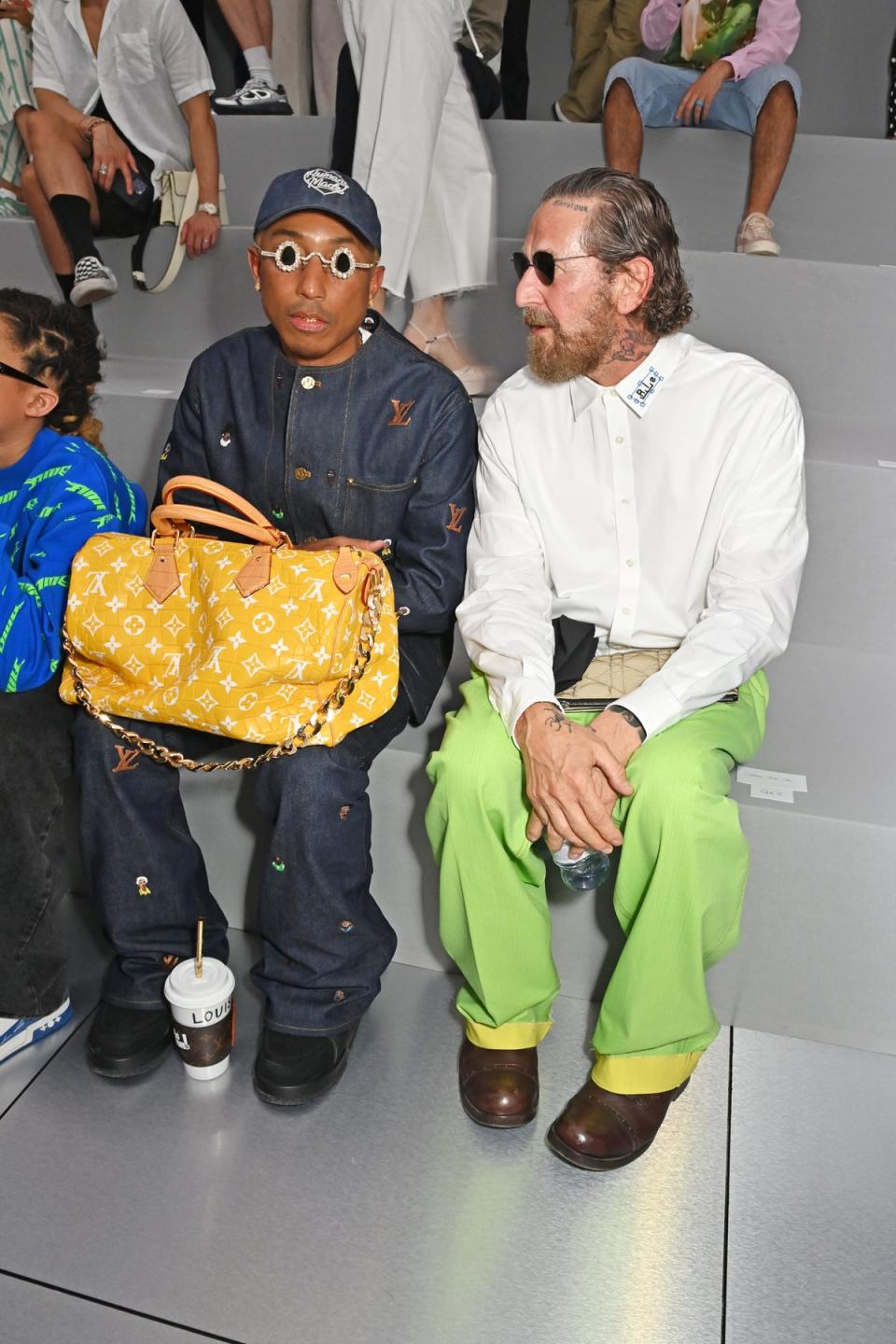 Pharrell Williams, creator of the ‘Millionaire Speedy’, holds it front row at Dior Homme, June 2023 (Dave Benett/Getty Images)