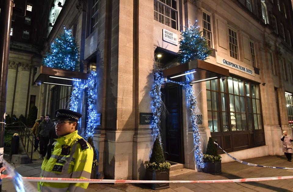 Police outside the Grosvenor House Suites in Park Lane, London, after a security guard was stabbed to death and three others injured as they tried to bar a group of men from entering a New Year's Eve party (John Stillwell/PA)