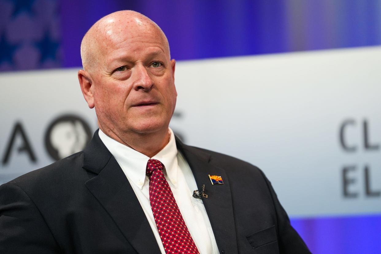 Kevin Thompson prepares before a debate for the office of Arizona Corporation Commissioner on Wednesday, June 22, 2022, in Phoenix.