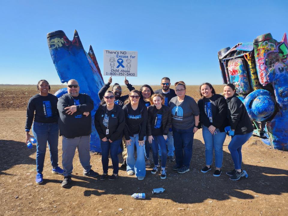 Texas Department of Family Protective Services and Saint Francis Ministries Paint the Cadillac Ranch Blue Wednesday to spread awareness for Child Abuse Prevention month.