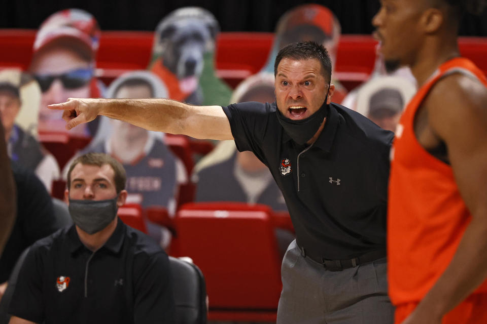 Sam Houston State coach Jason Hooten yells out to his team during the first half of an NCAA college basketball game against Texas Tech, Friday, Nov. 27, 2020, in Lubbock, Texas. (AP Photo/Brad Tollefson)