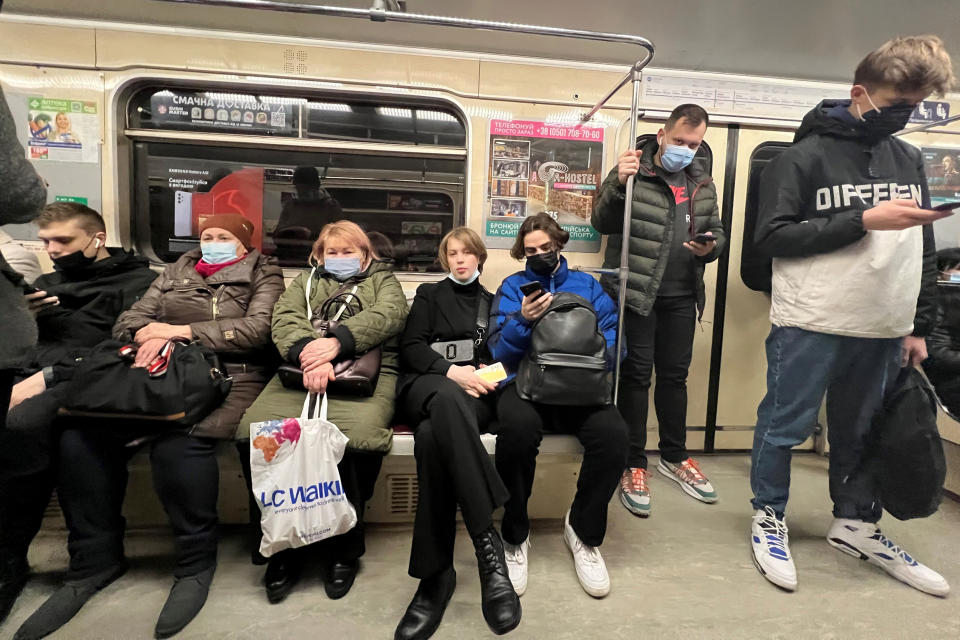 Kyiv residents ride the subway in Ukraine's capital Tuesday morning as life appears to run as normal. (Oksana Parafeniuk / NBC News)