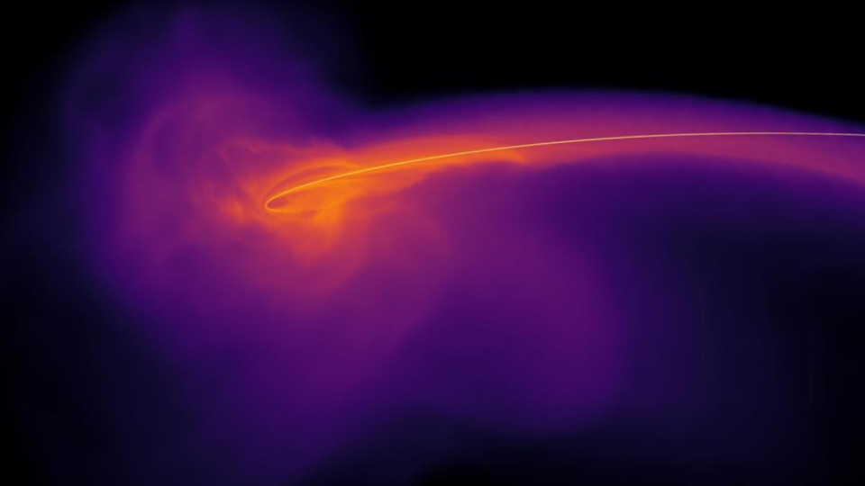     An orange vortex at the heart of a purple gas cloud. 