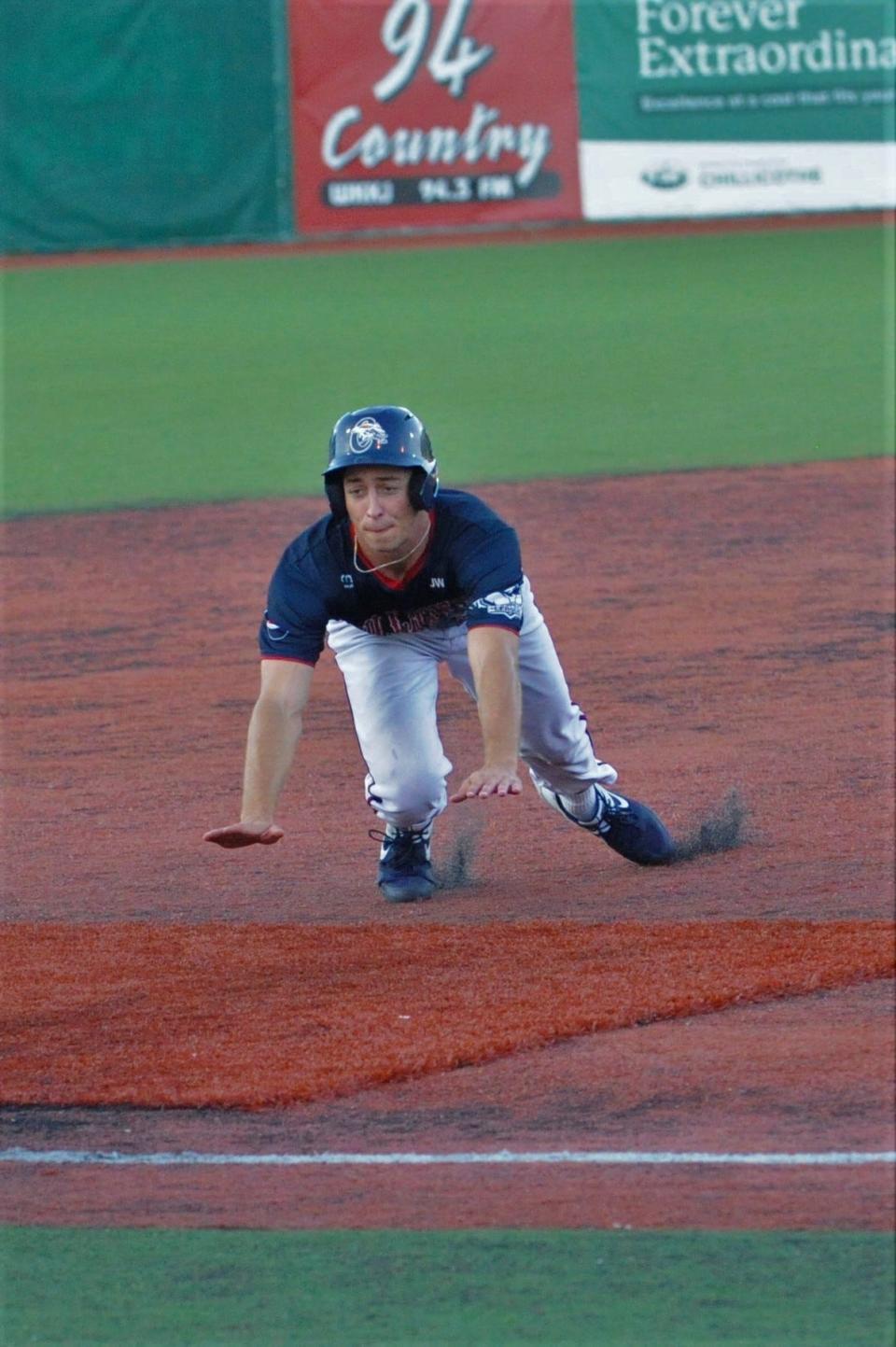 Chillicothe Paint, Jeron Williams, sliding towards third base.