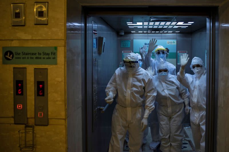 Medical workers treat patients infected with the coronavirus disease (COVID-19) at a hospital in New Delhi