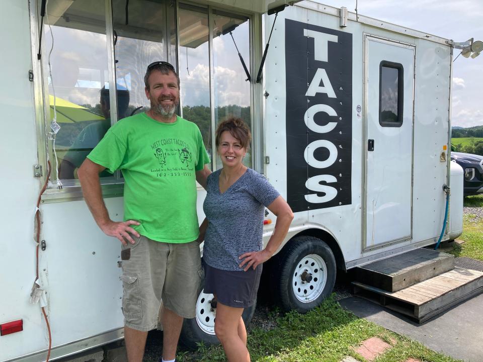 Jim and Paula Genier, owners of West Coast Tacos 2.0, stand outside the Benson business July 15, 2023.