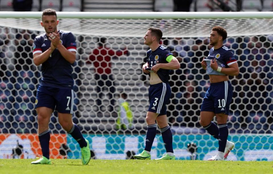 John McGinn (left) feels he let the Tartan Army down with Monday's defeat (PA Wire)