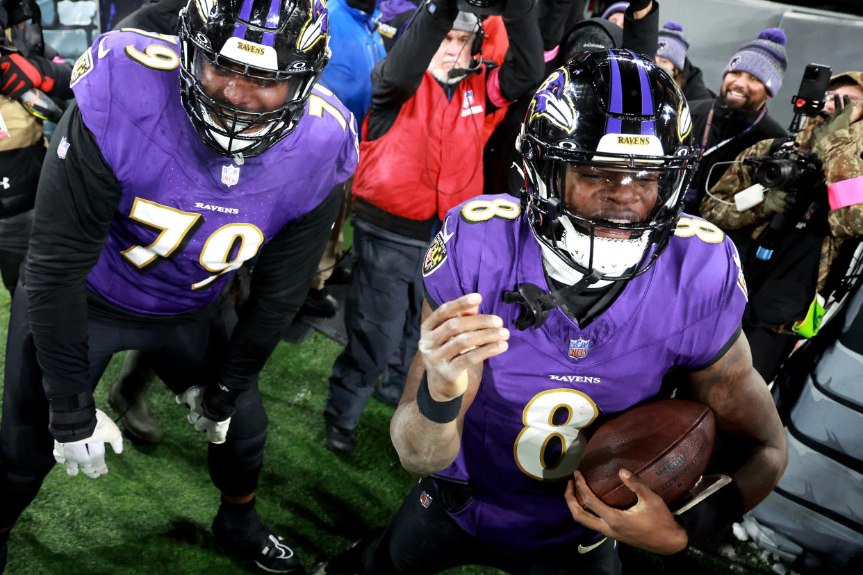 BALTIMORE, MARYLAND - JANUARY 20: Lamar Jackson #8 of the Baltimore Ravens celebrates with Ronnie Stanley #79 after rushing for a touchdown against the Houston Texans during the fourth quarter in the AFC Divisional Playoff game at M&T Bank Stadium on January 20, 2024 in Baltimore, Maryland.  (Photo by Rob Carr/Getty Images)