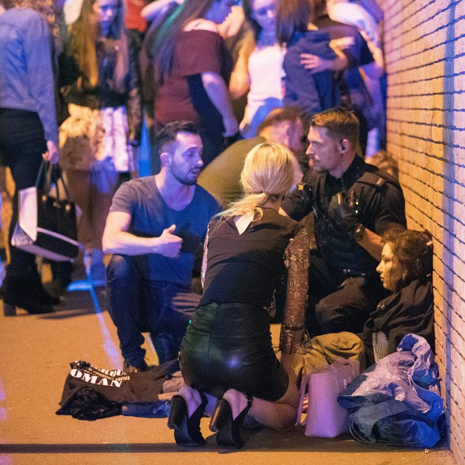 Injured concert-goers outside Manchester Arena - Credit:  Joel Goodman/LNP