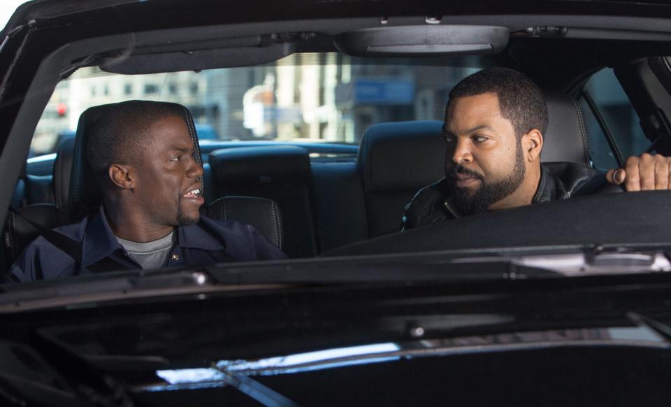 Kevin Hart and Ice Cube sitting in a car