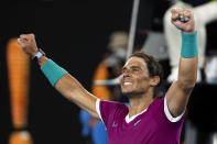 Rafael Nadal of Spain celebrates after defeating Matteo Berrettini of Italy in their semifinal match at the Australian Open tennis championships in Melbourne, Australia, Friday, Jan. 28, 2022. (AP Photo/Hamish Blair)