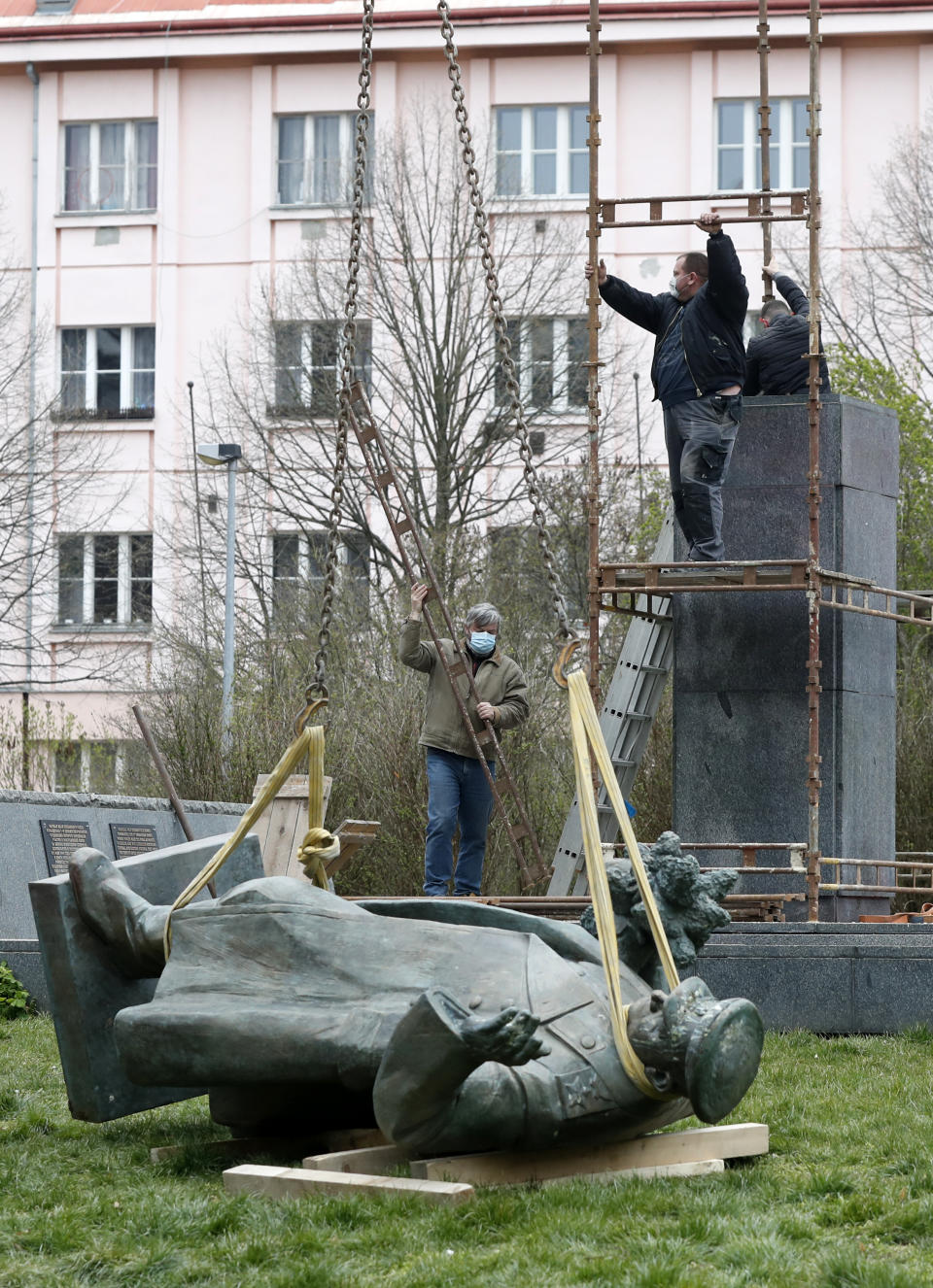 The statue of a Soviet World War II commander Marshall Ivan Stepanovic Konev is being removed from its site in Prague, Czech Republic, Friday, April 3, 2020. Marshall Konev led the Red Army forces that liberated Prague and large parts of Czechoslovakia from the Nazi occupation in 1945. His monument, unveiled in the Prague 6 district in 1980 when the country was occupied by Soviet troops, has been a source of controversy. (AP Photo/Petr David Josek)