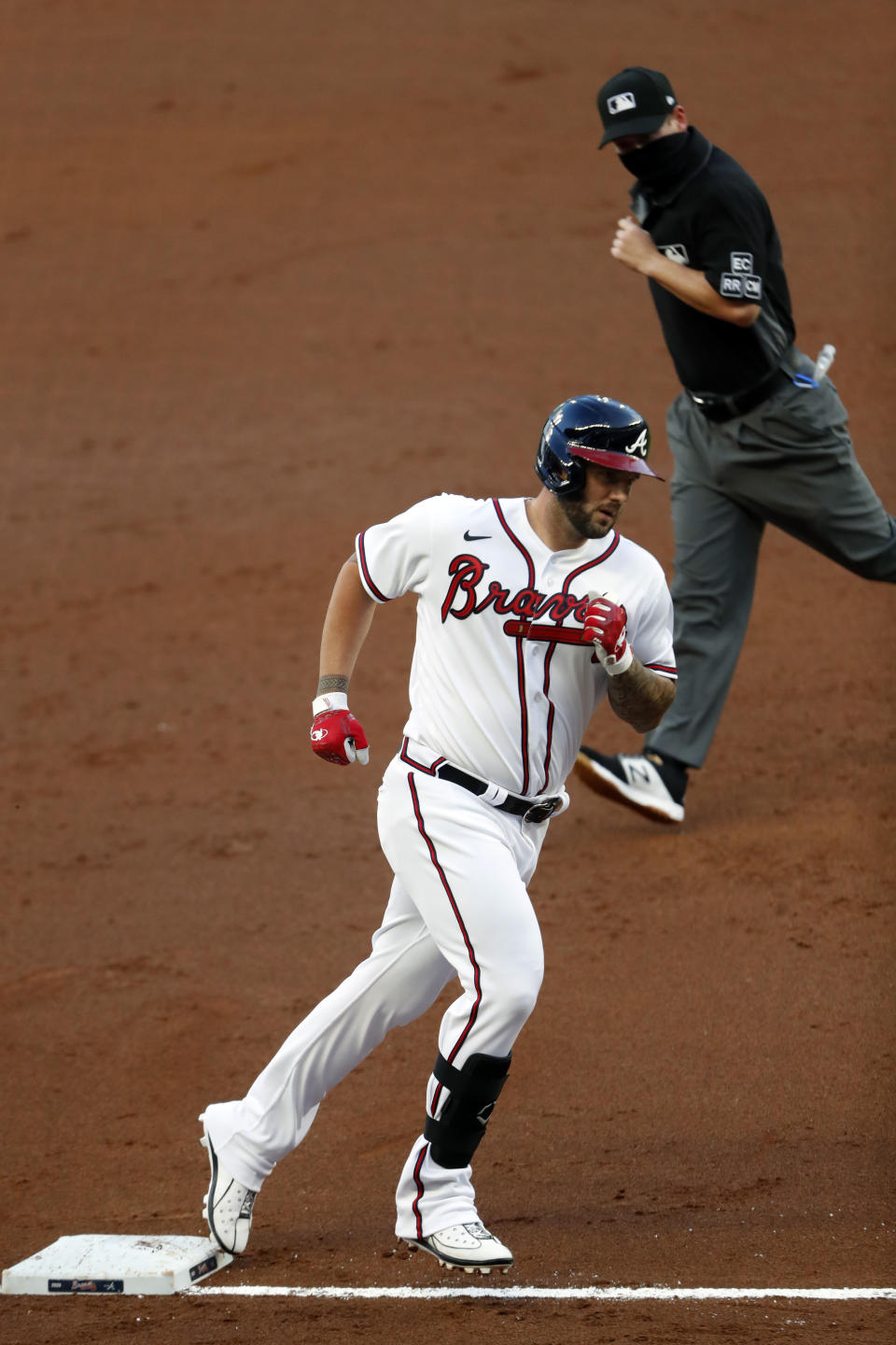 Atlanta Braves' Matt Adams (18) rounds third base after hitting a home run in the second inning of a baseball game against the Toronto Blue Jays Tuesday, Aug. 4, 2020, in Atlanta. (AP Photo/John Bazemore)