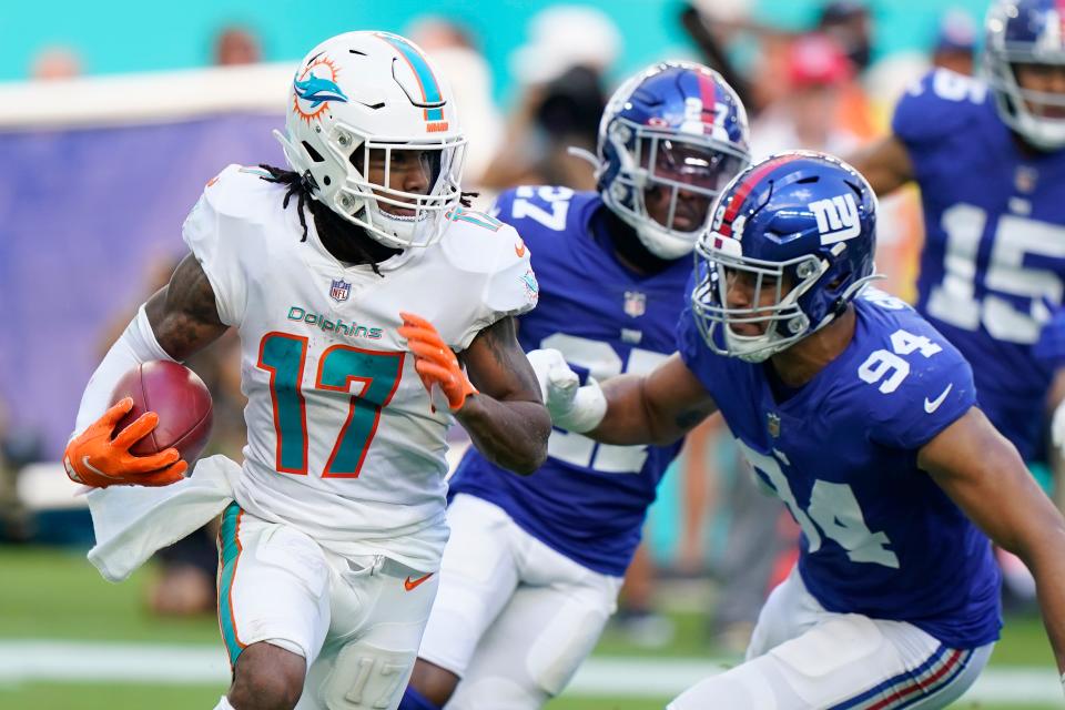 New York Giants linebacker Elerson Smith goes after Miami Dolphins wide receiver Jaylen Waddle (17) during the second half of an NFL football game, Sunday, Dec. 5, 2021, in Miami Gardens, Fla. (AP Photo/Wilfredo Lee)