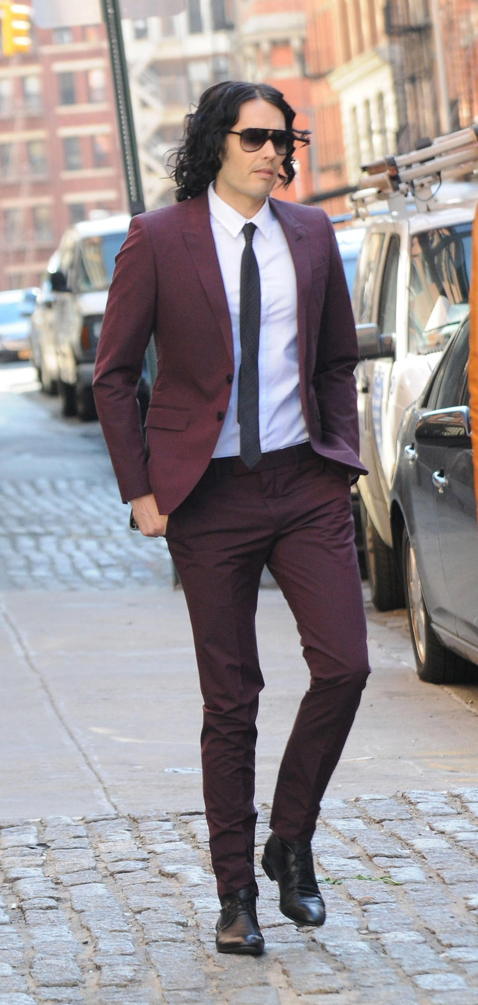 Russell in a maroon suit