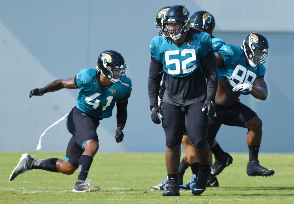 Jaguars Defensive Linemen #41, Josh Allen, #52, DaVon Hamilton and #98, Timmy Jernigan run through drills as the Jacksonville Jaguars went through practice in pads for the first time during training camp at the practice fields outside TIAA Bank Field Monday, August 17, 2020. [Bob Self/Florida Times-Union]