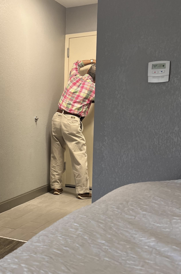 A man painting a door