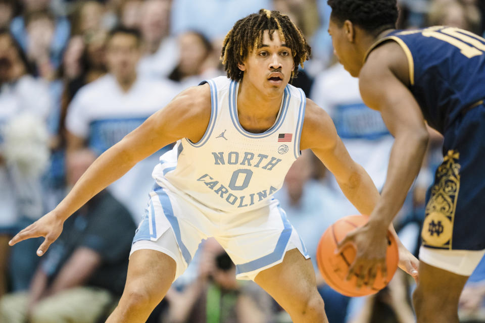 North Carolina guard Seth Trimble (0) guards Notre Dame guard Marcus Hammond (10) in the first half of an NCAA college basketball game on Saturday, Jan. 7, 2023, in Chapel Hill, N.C. (AP Photo/Jacob Kupferman)