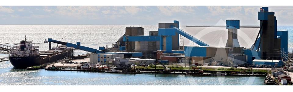 Salt manufacturing facility with plant and lakeside cargo loading terminal.