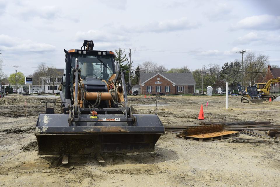 A bulldozer stationed at the construction site for a new theater on the south end of the plaza parking lot in St. Clair on Thursday, May 5, 2022.