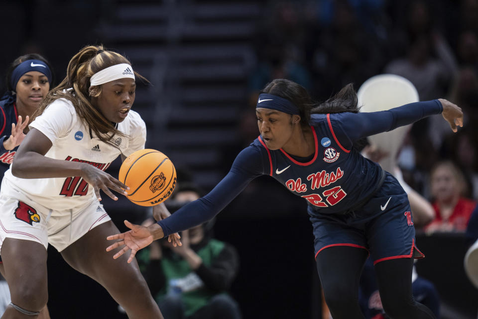 Mississippi foward Tyia Singleton, right, steals the ball from Louisville forward Olivia Cochran during the first half of a Sweet 16 college basketball game in the women's NCAA tournament Friday, March 24, 2023, in Seattle. (AP Photo/Stephen Brashear)