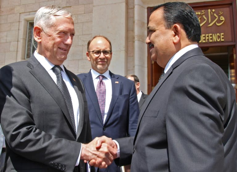 A handout picture released by the Iraqi government on August 22, 2017 shows Iraq's Defence Minister Erfan al-Hayali welcoming US Defence Secretary Jim Mattis