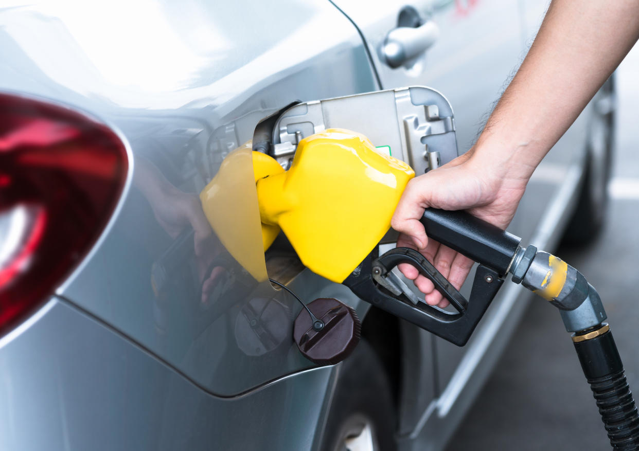 A car fuelling up at a petrol station.