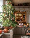 <p>This evergreen is covered entirely with edible decorations, like cookies, ribbon candy, gumdrops, and garlands of popcorn and cranberries.</p>