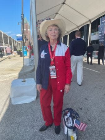 Attendee Gail Stanart wears an outfit featuring red, white and blue on the second day of the 2024 Republican National Convention in Milwaukee.
