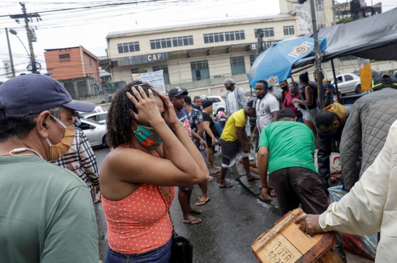 A resident reacts after a police operation against drug gangs in Rio de Janeiro