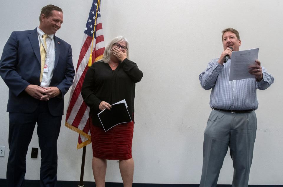 Jane Steinkamp, center, stands next to San Joaquin County Office of Education Superintendent Troy Brown as Greater Stockton Chamber of Commerce CEO Tim Quinn announces Steinkamp as the recipient of the 2022 ATHENA Award. Steinkamp was leading a teachers workshop at the SJCOE when she was surprised with the announcement.
