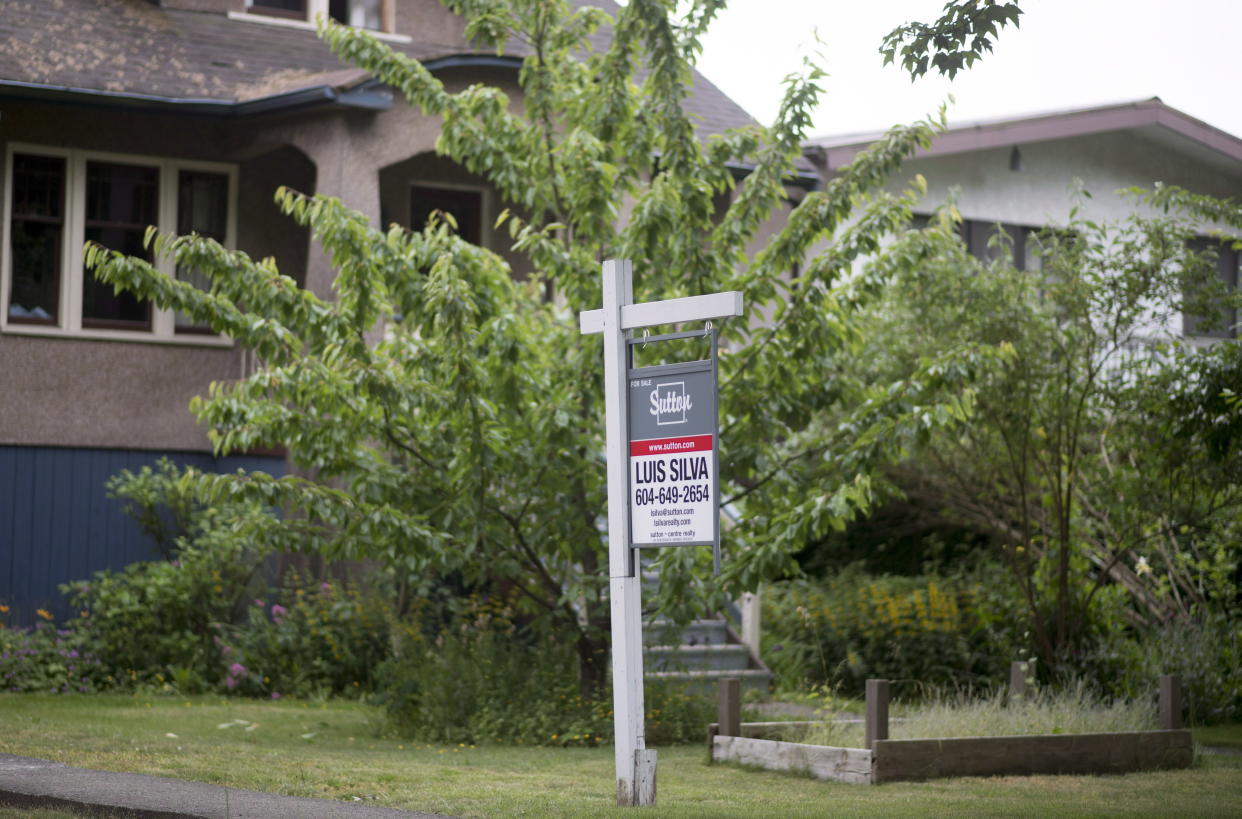 A real estate sign is pictured in Vancouver, B.C., Tuesday, June 12, 2018. THE CANADIAN PRESS Jonathan Hayward