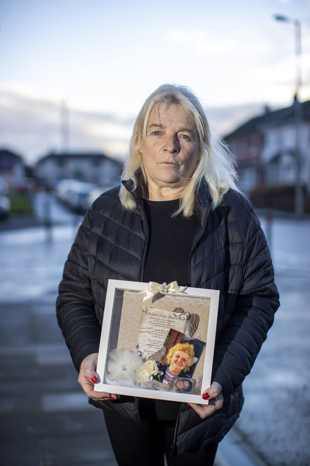 Margaret Deery holds an image of her mother Peggy Deery, the only woman shot on Bloody Sunday in Derry (Liam McBurney/PA)