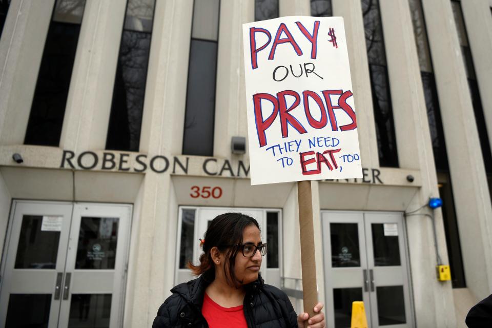 Zainab Tanvir, a grad student who studies and teaches biology at Rutgers-Newark, rallies for equal pay and higher salaries for teachers assistants like herself and full-time faculty on Tuesday, April 9, 2019, in Newark. 