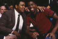 <p>Magic Johnson poses for the camera with Muhammad Ali. (Photo by Focus on Sport/Getty Images)</p>