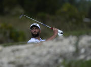 Jon Rahm, of Spain, watches his shot from the first fairway during the second round of the Hero World Challenge PGA Tour at the Albany Golf Club, in New Providence, Bahamas, Friday, Dec. 2, 2022. (AP Photo/Fernando Llano)
