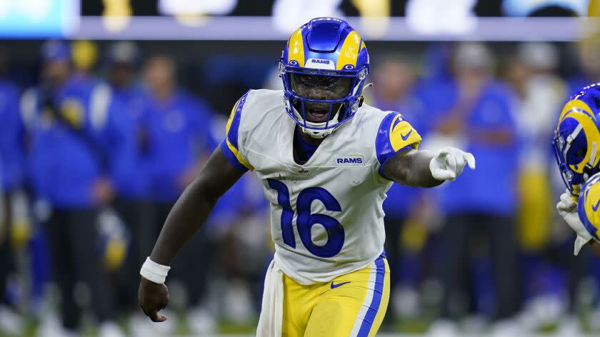 Los Angeles Rams quarterback Bryce Perkins (16) points at a teammate during.