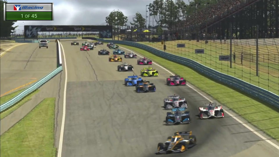 In this image taken from video provided by iRacing IndyCar, IndyCar Pato O'Ward, foreground, heads into a turn during opening lap of the American Red Cross Grand Prix virtual IndyCar auto race at Watkins Glen International, Saturday, March 28, 2020. (iRacing IndyCar via AP)