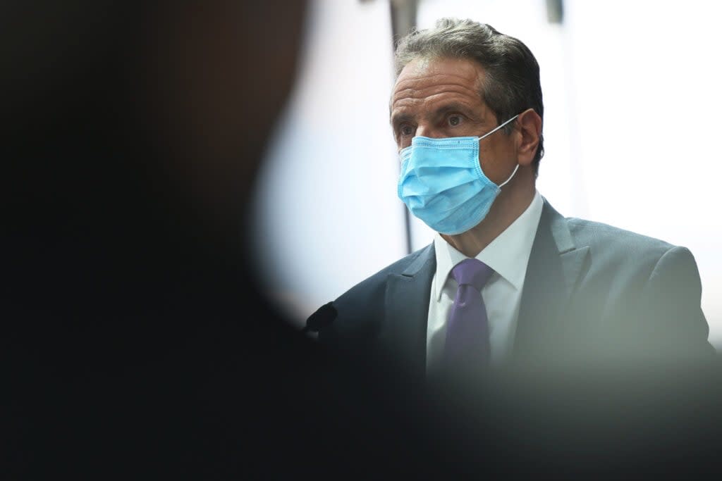 Gov. Andrew Cuomo listens as Alan Steel, president and CEO of the New York Convention Center Operating Corporation, speaks during a press conference at the Javits Center in Manhattan on May 11, 2021 in New York City. Gov. Cuomo held the press conference to give an update on coronavirus (COVID-19) efforts and to announce the expansion of the Javits Center as well as various projects in what he called the “Reimagine, Rebuild, Renew” campaign to support the reopening and recovery of New York State due to the impact of the pandemic. (Photo by Michael M. Santiago/Getty Images)