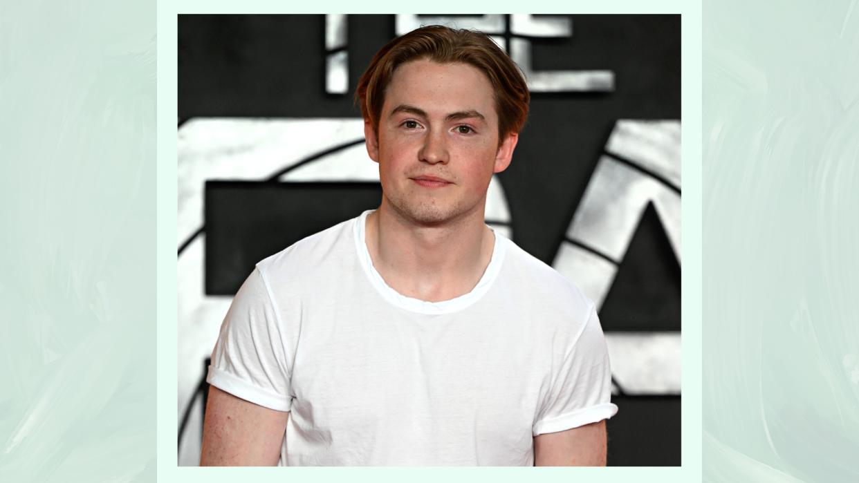   Kit Connor wears a white t-shirt as he attends "The Gray Man" Special Screening at the BFI Southbank on July 19, 2022 in London, England/ in a pastel green template 