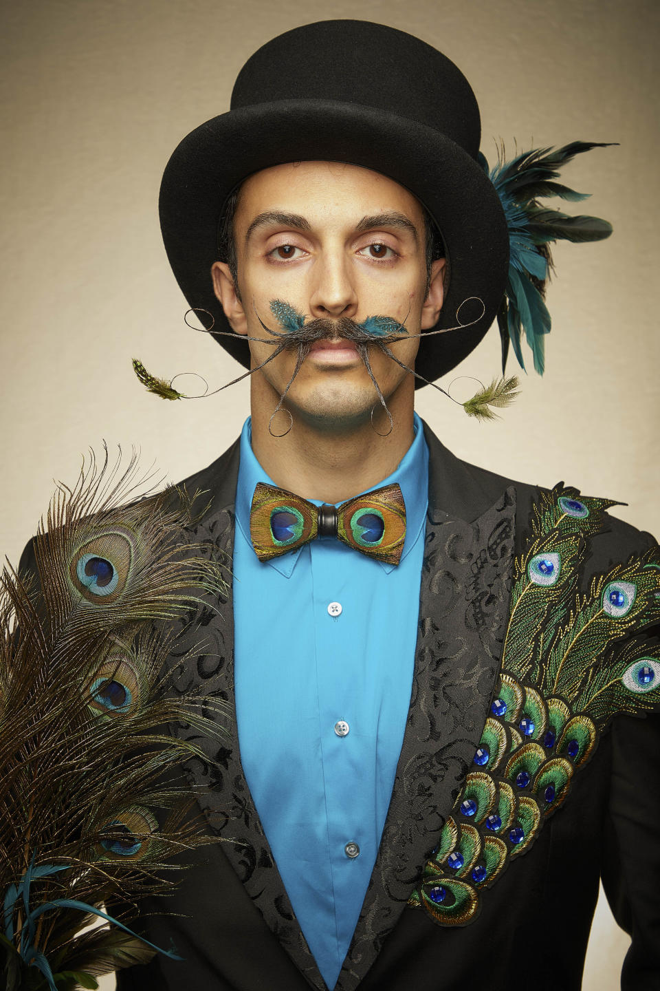 This peacock inspired moustache is a true artwork. [Photo: Caters]