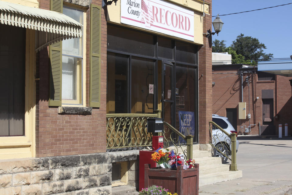 The offices of the Marion County Record await the arrival of copies of its latest weekly edition, Wednesday, Aug. 16, 2023, in Marion, Kan. The paper found its work on that edition hindered because of raid on its offices and the home of its publisher on Aug. 11, 2023, by local police. (AP Photo/John Hanna)