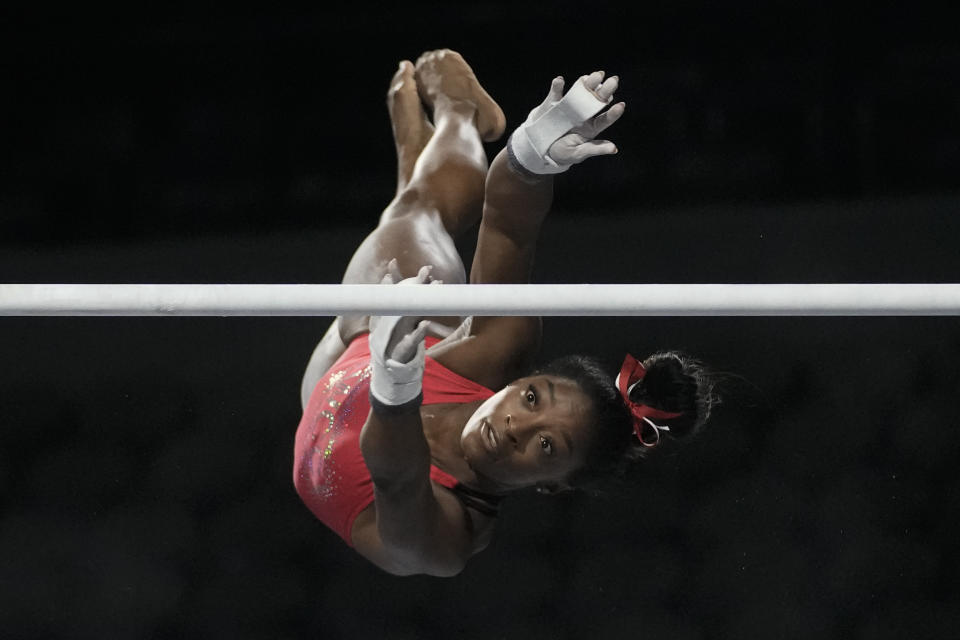 CAPTION CORRECTION CORRECTS SPORT: Simone Biles, a seven-time Olympic medalist and the 2016 Olympic champion, practicers on the uneven bars at the U.S. Classic gymnastics competition Friday, Aug. 4, 2023, in Hoffman Estates, Ill. (AP Photo/Morry Gash)
