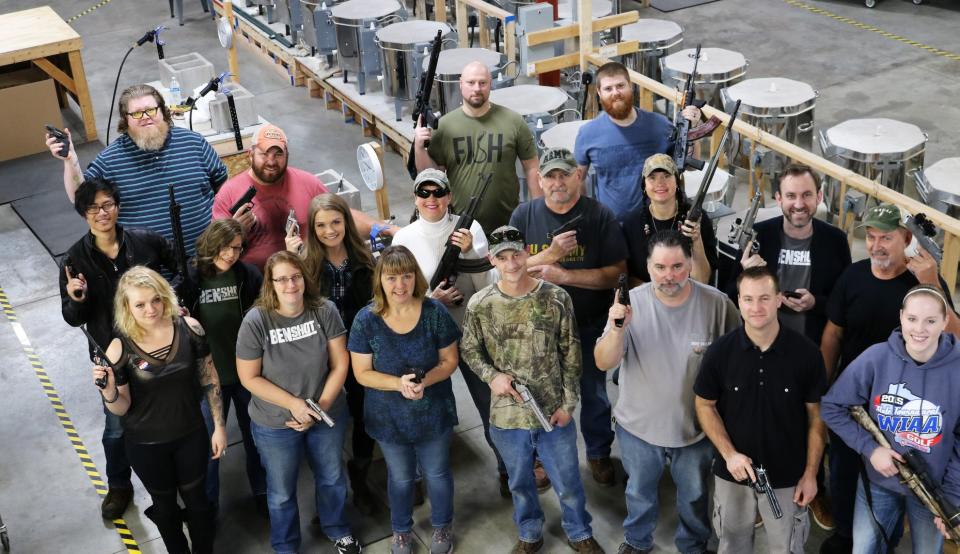 The owners of BenShot, a novelty glassware company in Wisconsin, gave their employees guns as a Christmas present. (Photo: Facebook/BenShot)