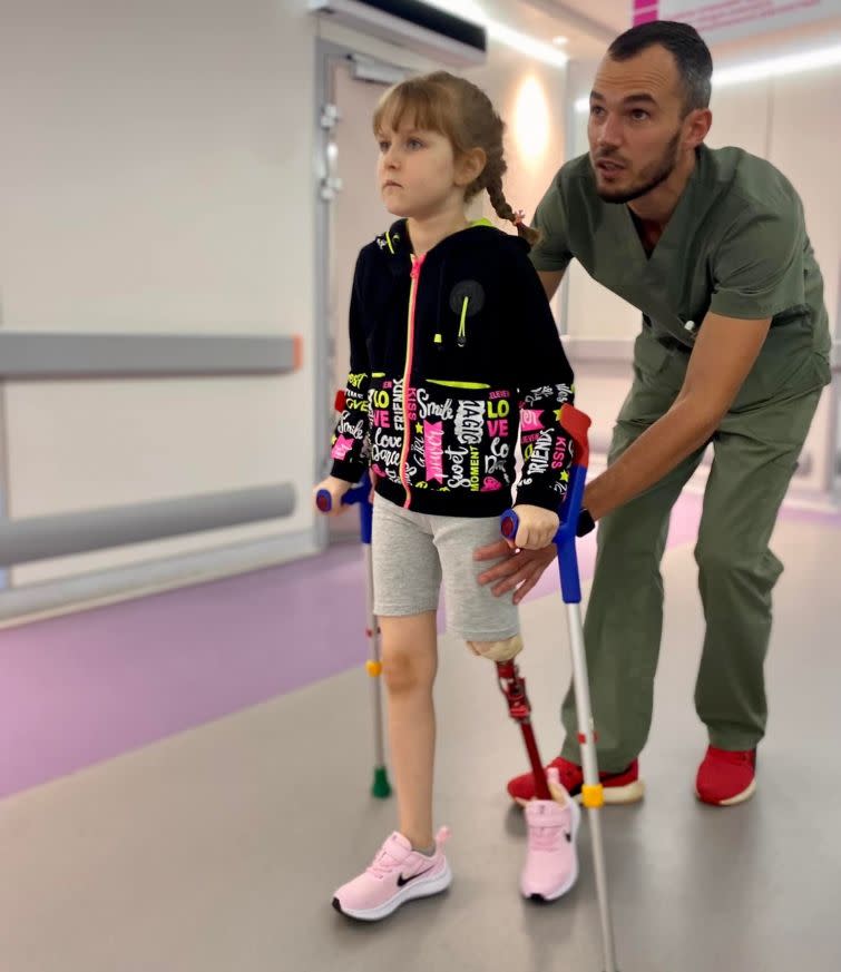 In an undated photo, Maryna Ponomarova overgoes physical rehabilitation with Nazar Borozniuk, a physical therapist at Ohmatdyt Hospital in Kyiv, Ukraine. (Courtesy of Ohmadyt)