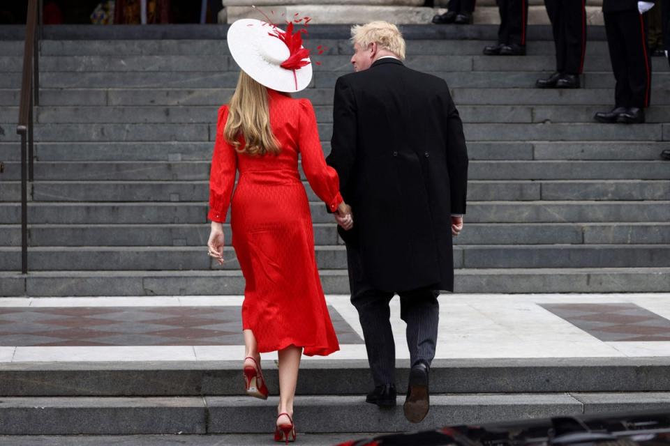 The couple pictured arriving at the service. (POOL/AFP via Getty Images)