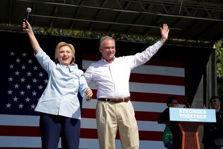 U.S. Democratic presidential candidate Hillary Clinton is joined by her running mate, vice-presidential candidate and U.S. Senator Tim Kaine, during a campaign stop at the 11th Congressional District Labor Day Parade and Festival in Cleveland, Ohio, United States September 5, 2016. REUTERS/Brian Snyder