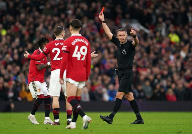 Referee Andre Marriner waves the red card